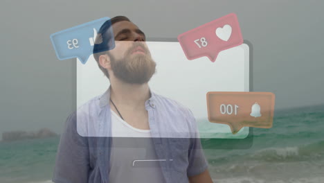 at beach, bearded man with animation of social media notification icons