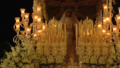 religious procession float with virgin mary and candles