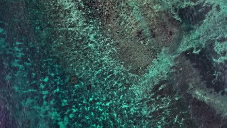 exotic shallow ocean coastine in indonesia, aerial top down view
