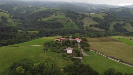 Cottages-in-the-green-hills-of-the-Basque-Country,-Spain