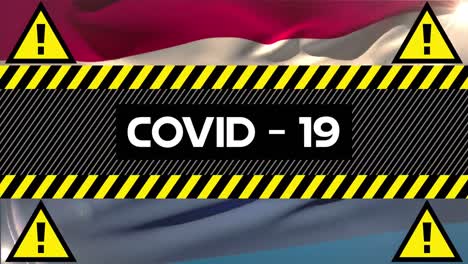 animation of the word covid-19 written on yellow and black tape over a flag of holland in the backgr