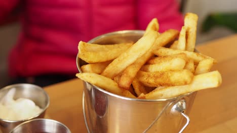 child eating french fries