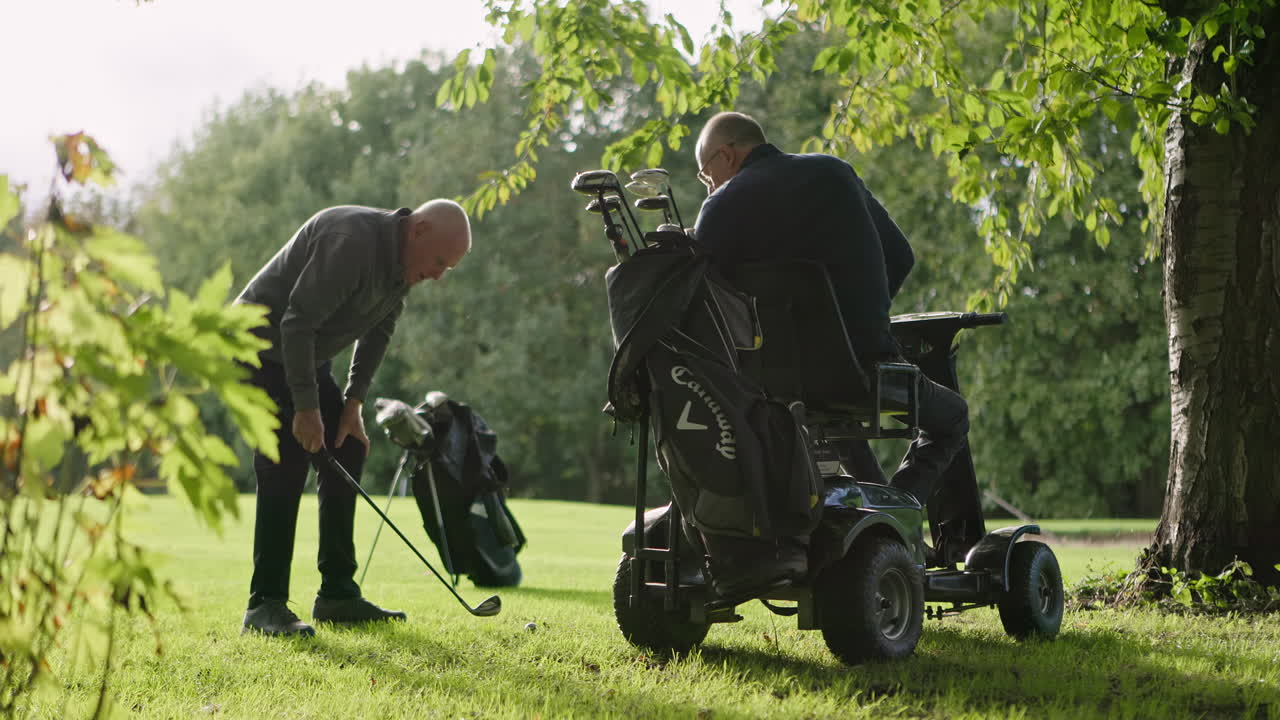 Golfers playing golf with a golf cart