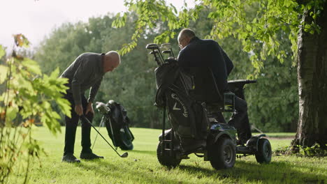 golfers playing golf with a golf cart