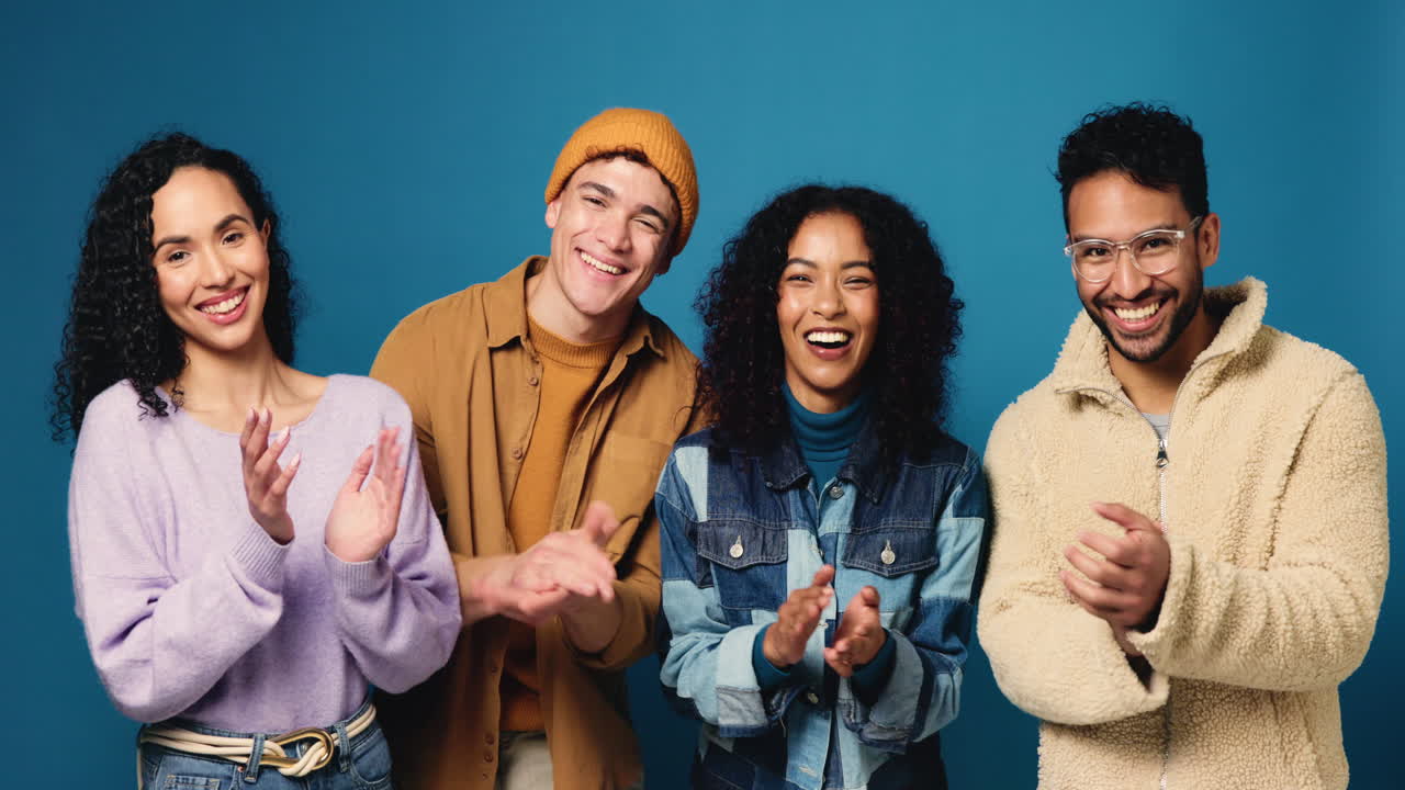 Group of friends clapping and celebrating