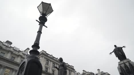 london street scene with statues and lampposts