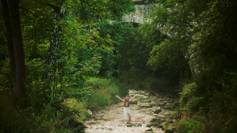 majestic view of a woman in the river meditating