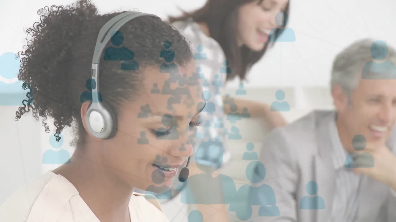 Animation of network of connection with icons over business people wearing phone headsets
