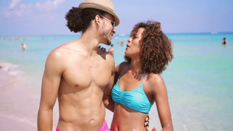 couple standing and embracing at oceanside