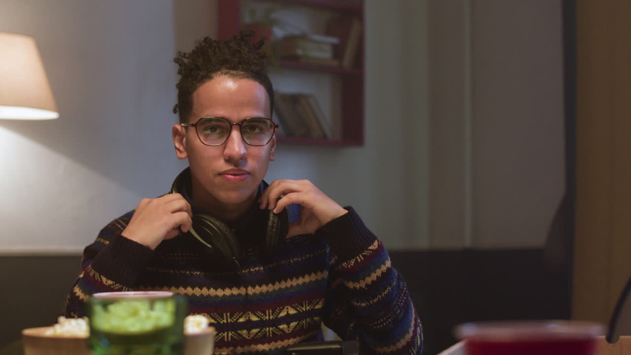 Young guy listening to music at home