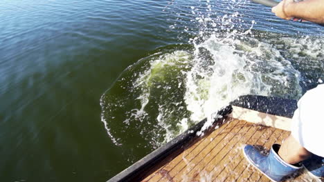 alligator hunter hooked on large alligator which thrashes in water, slow motion