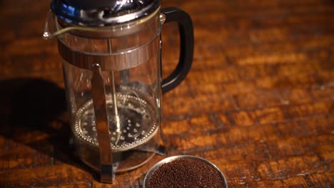 pan down of french press and coffee grounds