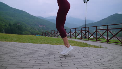 woman jumping rope outdoors