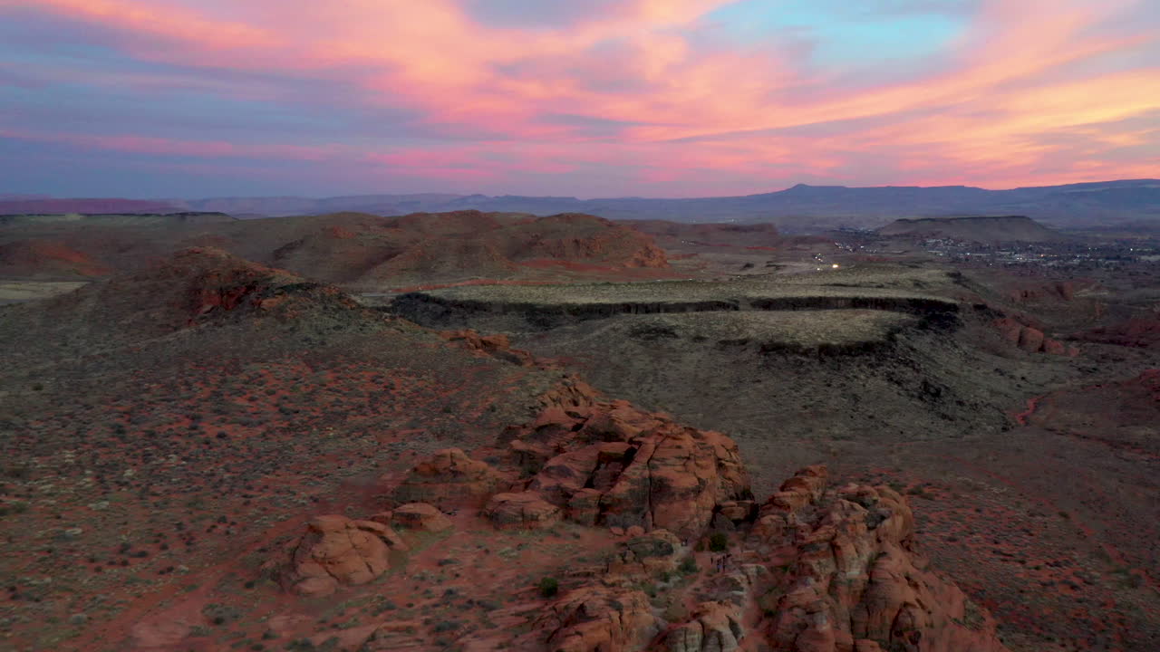 St. George, Utah USA. Beautiful, amazing aerial shot of the red rocks showing the hills and mountains at sunset. Establishing shot of the area