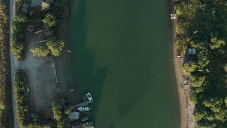 Aerial-view-of-fishing-huts-in-the-river,-Lido-di-Dante,-Fiumi-Uniti,-Ravenna-near-Comacchio-valley