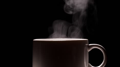 hot coffee cup on black background