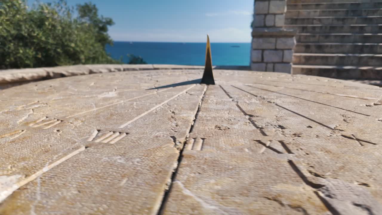 Low close up of Sun Clock in Tarragona, intricate design in a public space, rich in cultural heritage