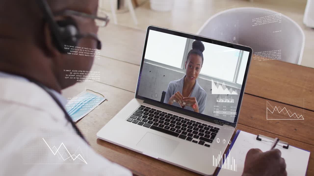 Animation von Finanzdatenverarbeitung über einem afroamerikanischen Geschäftsmann, der einen Laptop für einen Videoanruf benutzt