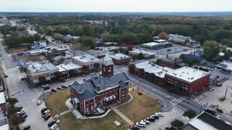 the town of jackson in the state of ga used for stranger things as "downtown hawkins" part 1 - buildings and transit driving by and parked during morning time