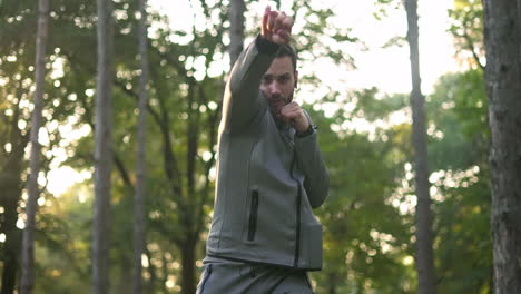 man boxing in the forest