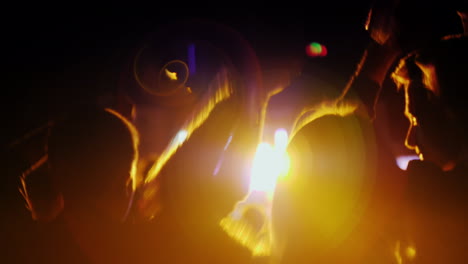 woman with two teenage children having fun at a rock concert dancing and actively applauding 4k 10 b