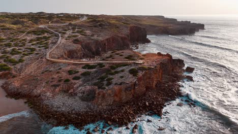 stunning aerial view of portugal's coastal cliffs at sunset