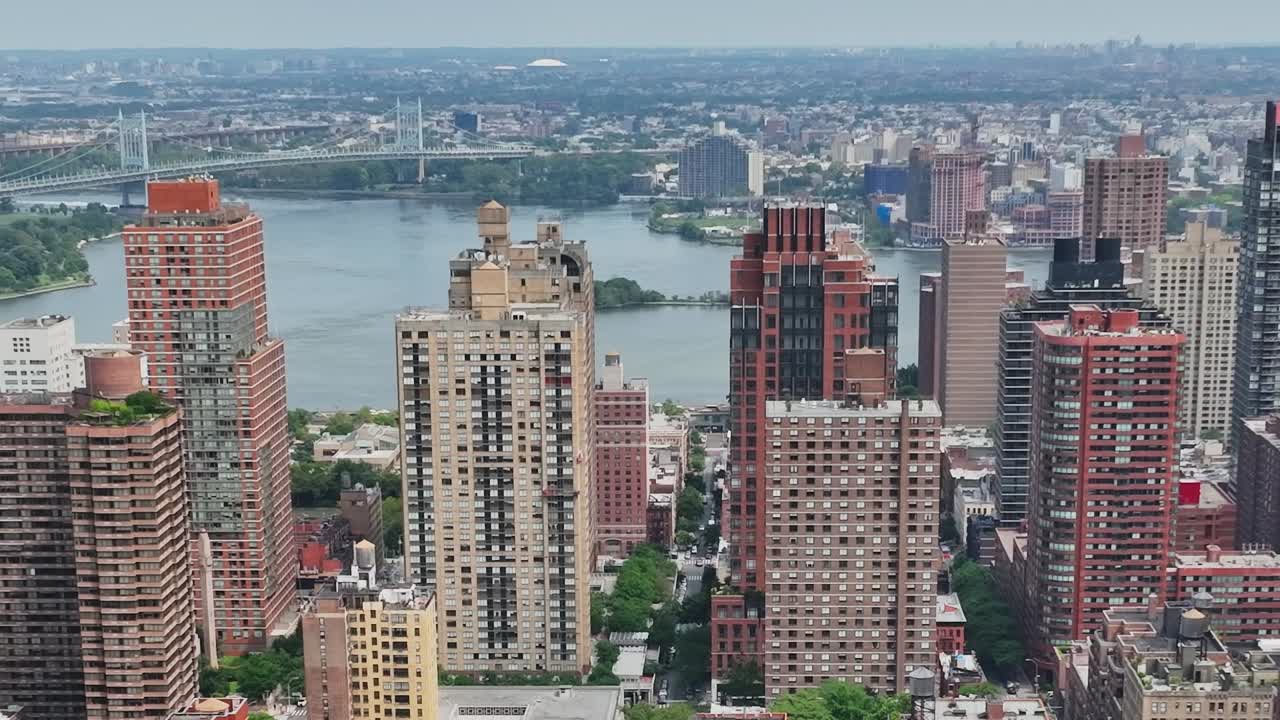 Aerial view of urban landscape in New York City with river and bridges