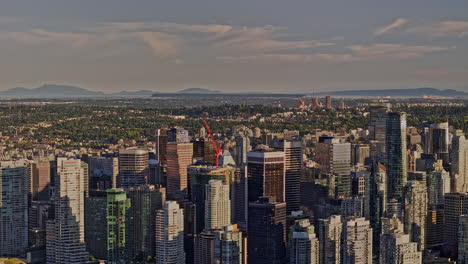 vancouver bc canada aerial v56 zoomed drone flyover downtown capturing urban cityscape of coal harbour with towering skyscrapers and waterfront marina - shot with mavic 3 pro cine - july 2023