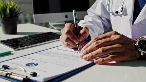 Doctor Signing a Prescription
