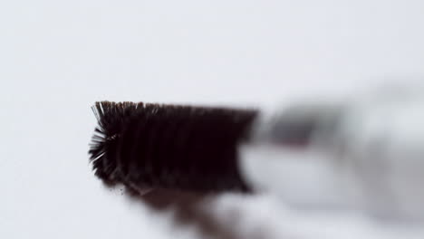 mascara brush or spoolie crushing eyeliner shavings