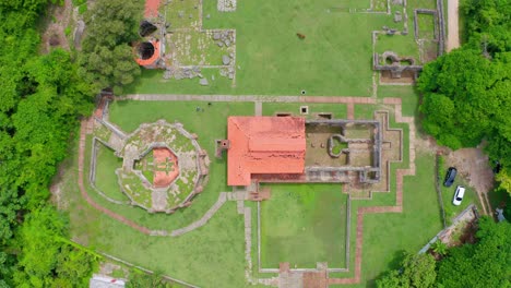 aerial drone descending over ruins of nigua sugar mill or ingenio boca de nigua in dominican republic