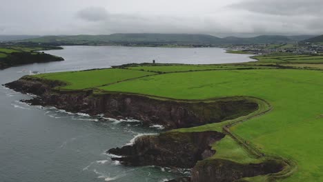 a 4k dropping shot of bin ban cliffs dingle co kerry where corrosion is eroding the cliffs beside beenbane beach