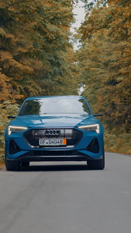new modern city car driving on the road. stylish auto speed driving and traveling. vertical video