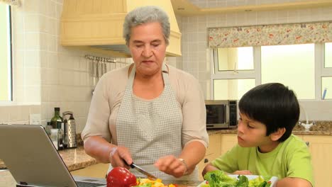 Little-boy-cooking-with-his-grandmother