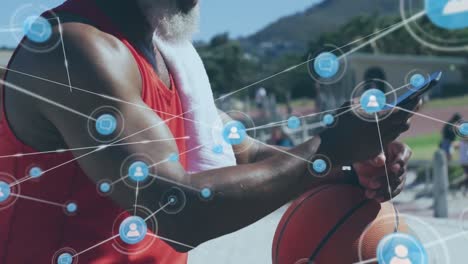 Animation-of-network-of-connections-over-senior-african-american-man-using-smartphone-at-beach