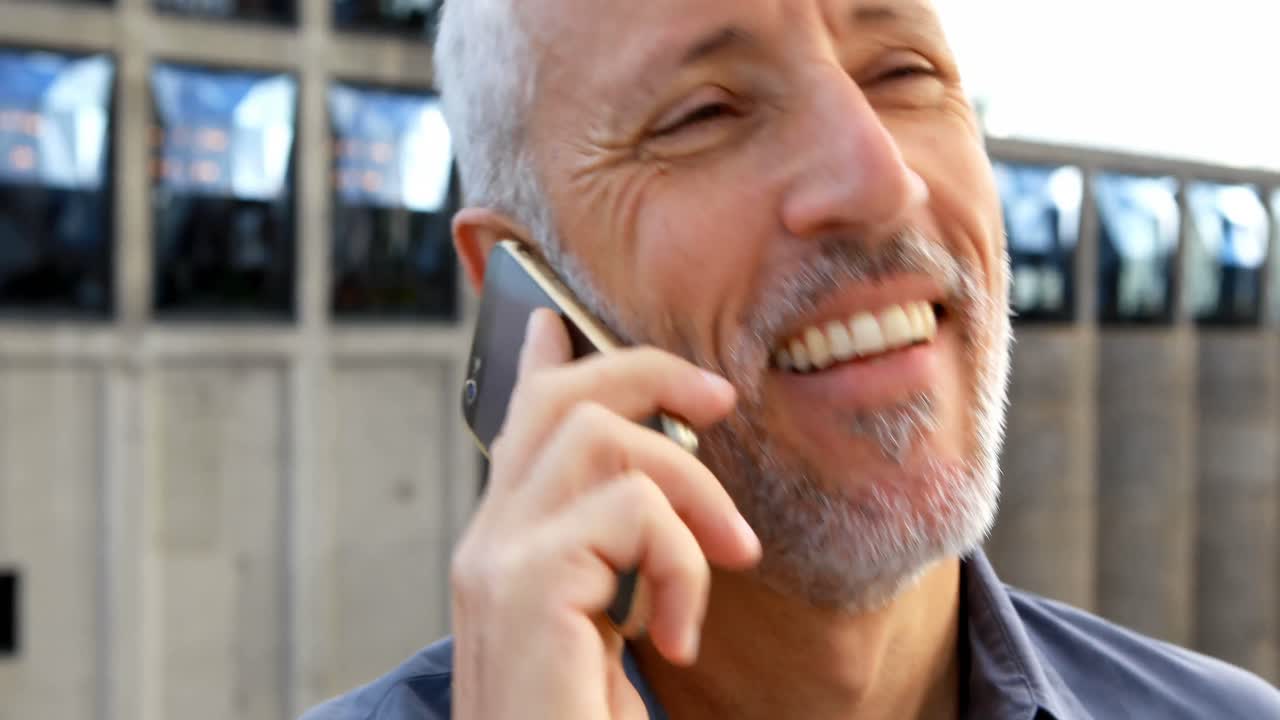 Businessman talking on mobile phone in hotel balcony 4k