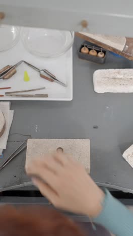 jewelry making and metalworking tools on a workbench