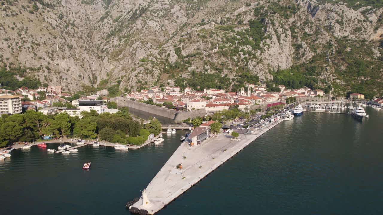 Aerial orbit around empty port of Kotor in Montenegro on a sunny summer day