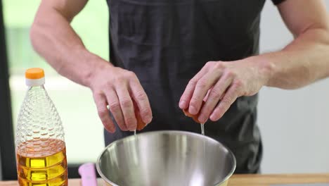 person cracking an egg into a bowl