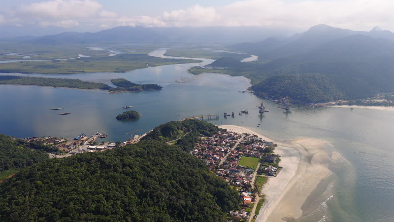 High altitude aerial view of the work in progress new Guaratuba-Caiobá Bridge and its beautiful environment, South America, Paraná, Brazil