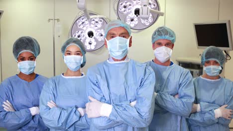 surgical team looking at the camera in operating theater