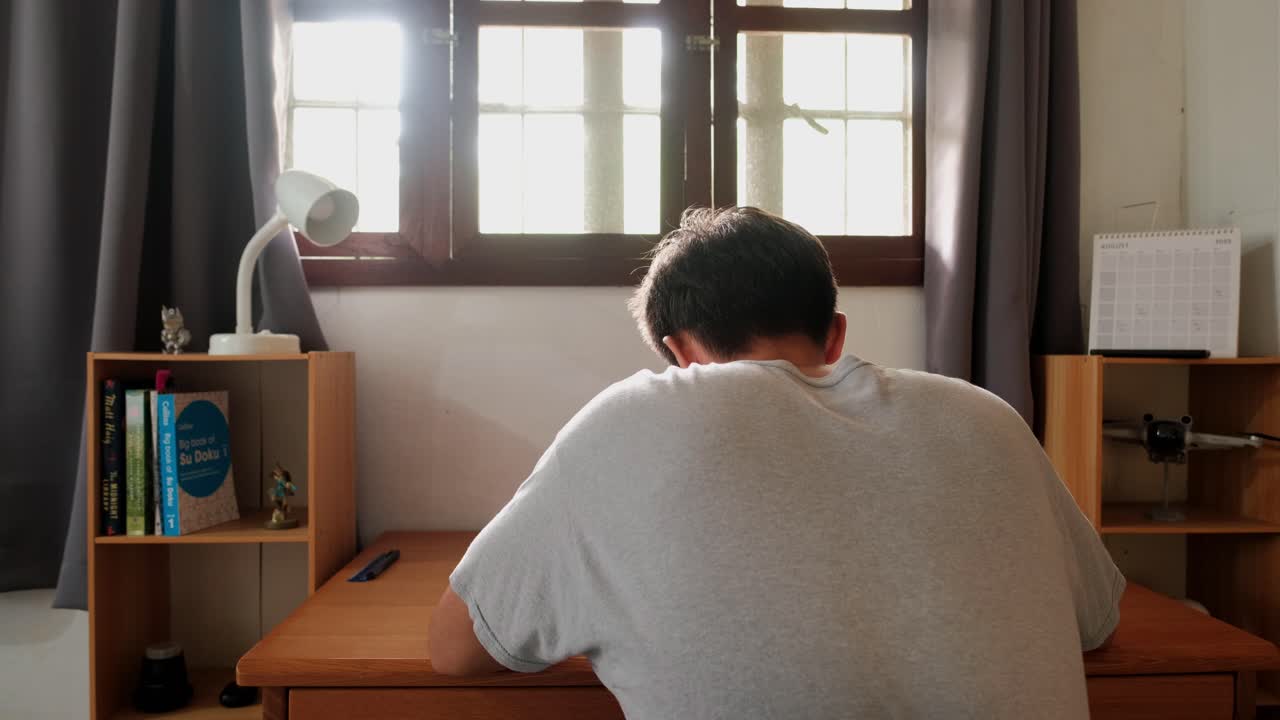 Man sitting at desk in room
