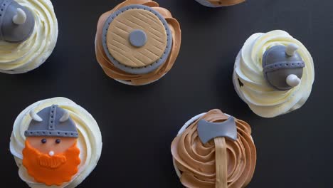 topdown rotation shot over viking theme cupcakes, creative birthday party ideas