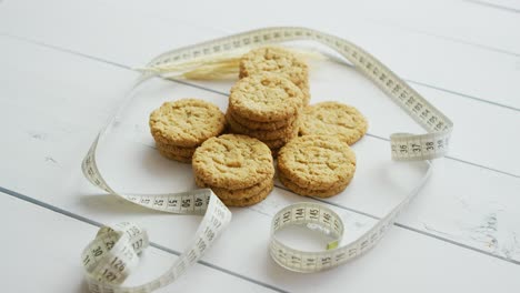 healthy oatmeal cookies on white wood background  side view