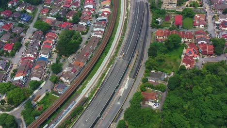 aerial birds eye view, drone flyover taman desa seputeh capturing highways and residential neighborhood at kuala lumpur, malaysia