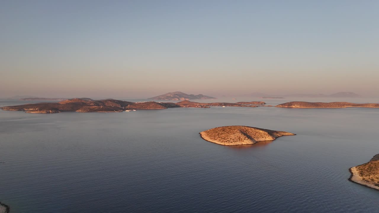 Greek Islands in the Aegean sea | Aerial shot from Irakleia, and Schoinousa island in the background | 4K drone shot