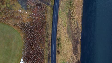 Isolated-Icelandic-road-along-coast-overhead-Aerial