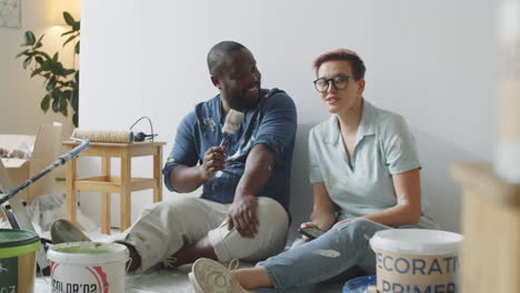 couple painting a room together