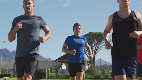 men running outside on sunny day