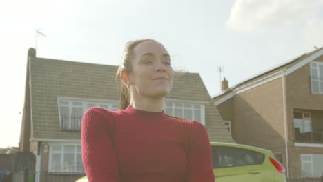 Young-woman-turns-off-her-phone-and-relaxes-outside